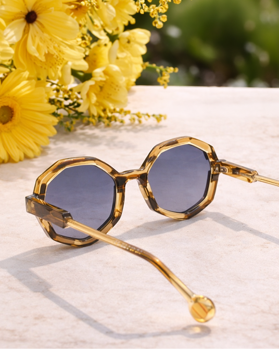 white women with short blonde hair wearing oversized clear cat eye sunglasses