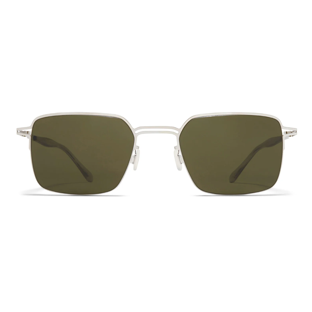 Sunglasses with green lenses and silver frame on a white background