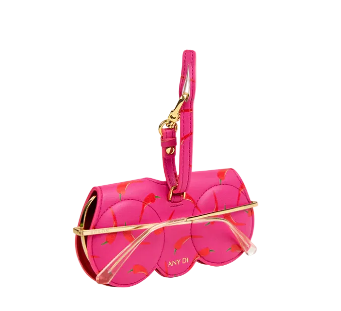 Pink eyewear case with chili pepper design and gold accents on a white background